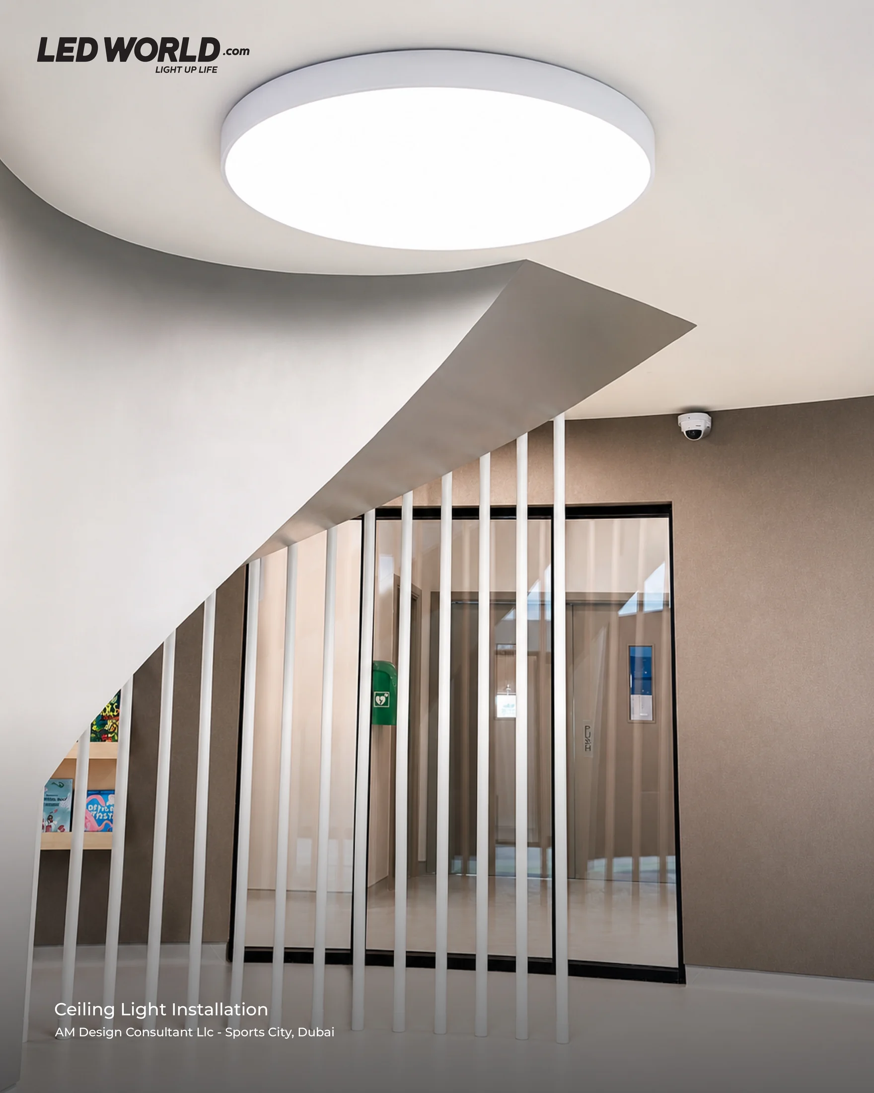 Circular ceiling luminaire above a vertical partition at the AM Design Consultant project